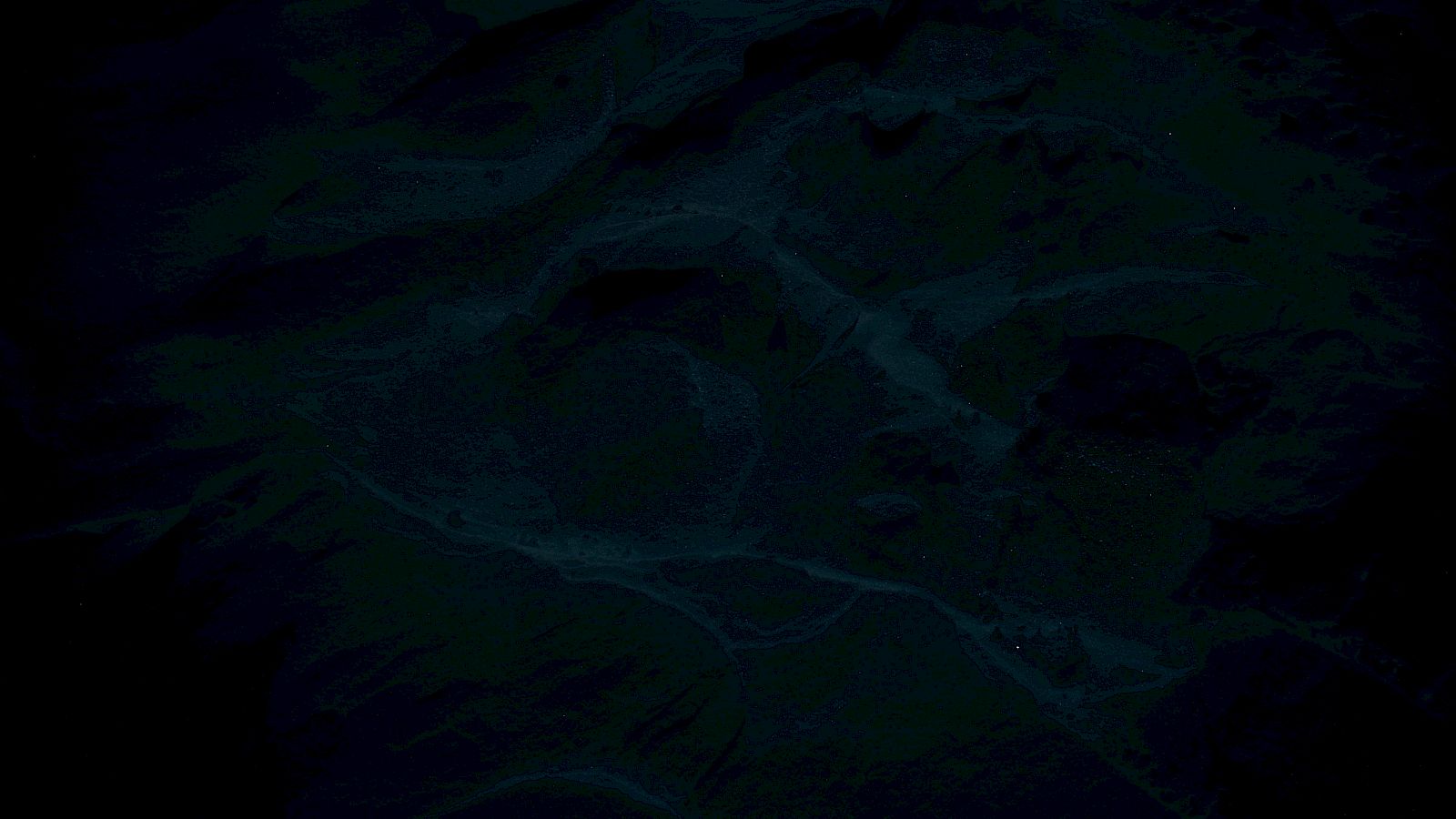 The image is too dark to clearly identify any specific details or subject matter.